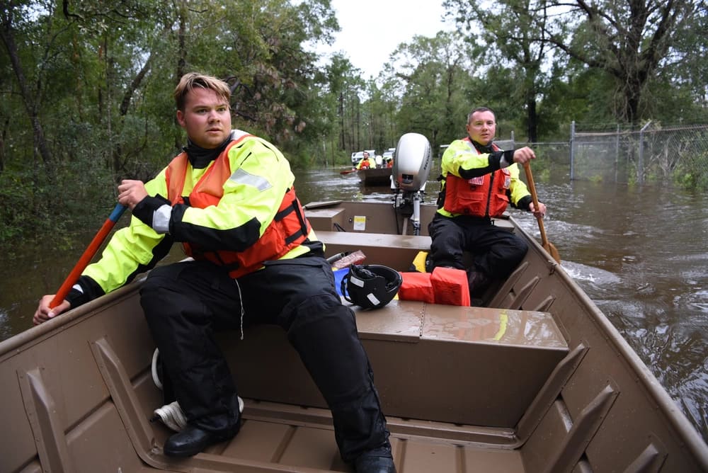 2 people in a paddling in a boat